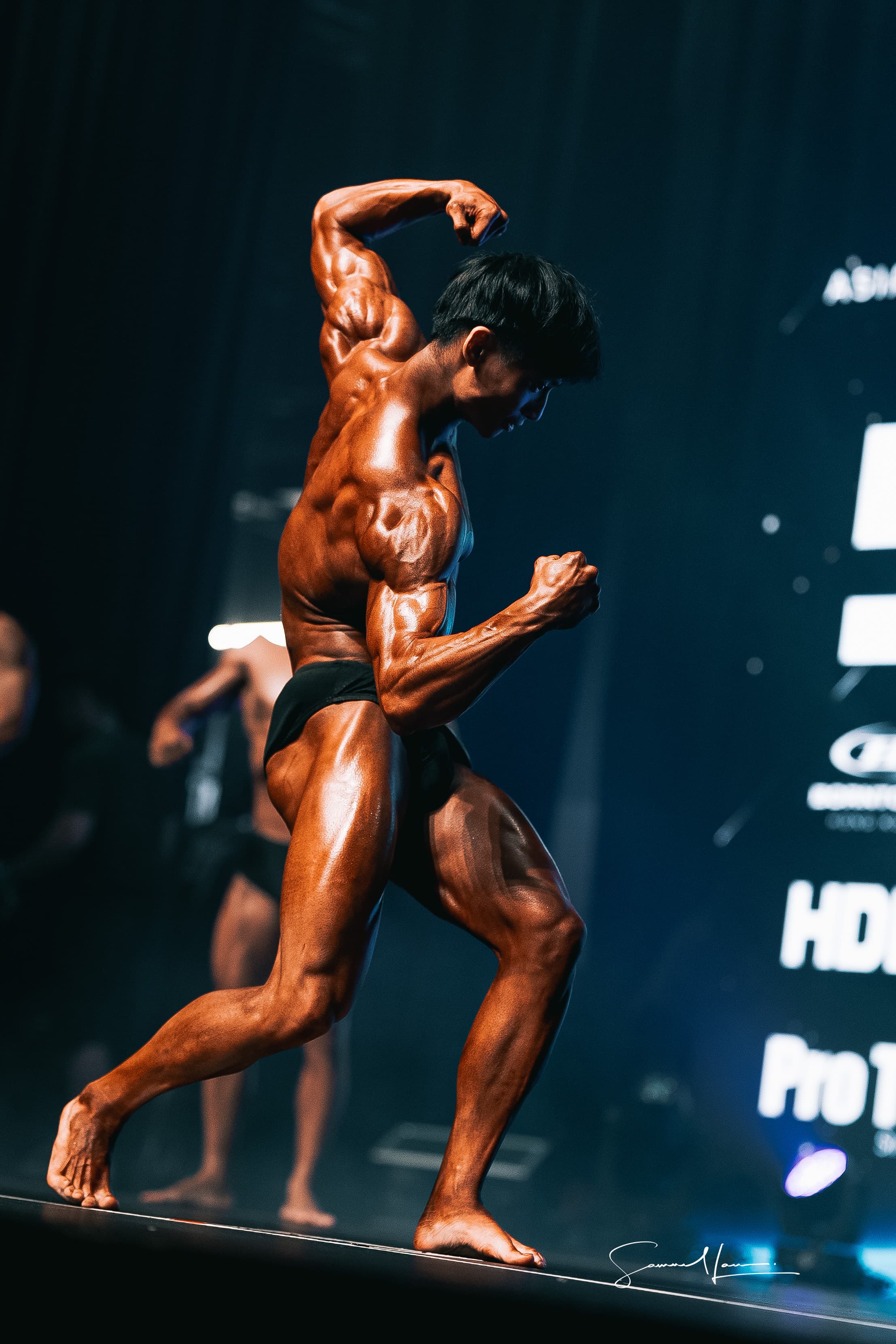 Full-length shot of Vincent posing on stage